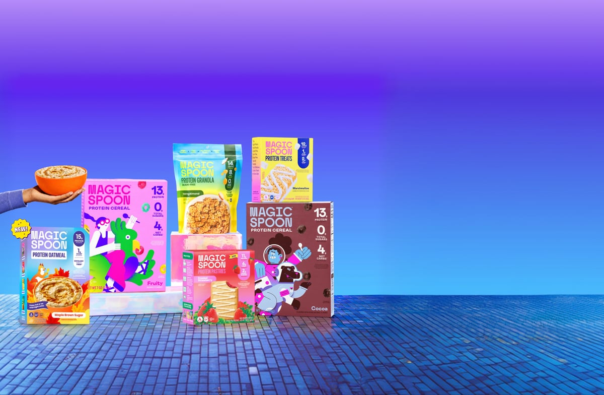 Colorful Magic Spoon cereal and snack packaging against a purple and blue backdrop